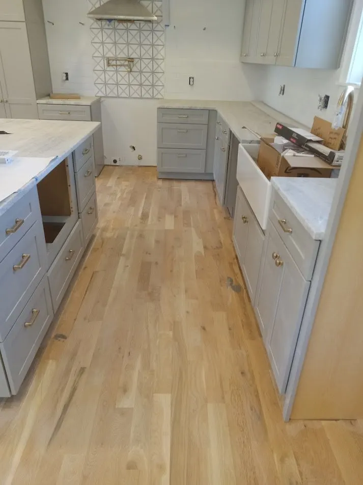 White oak kitchen floor finished with a natural water-based sealer and satin topcoat