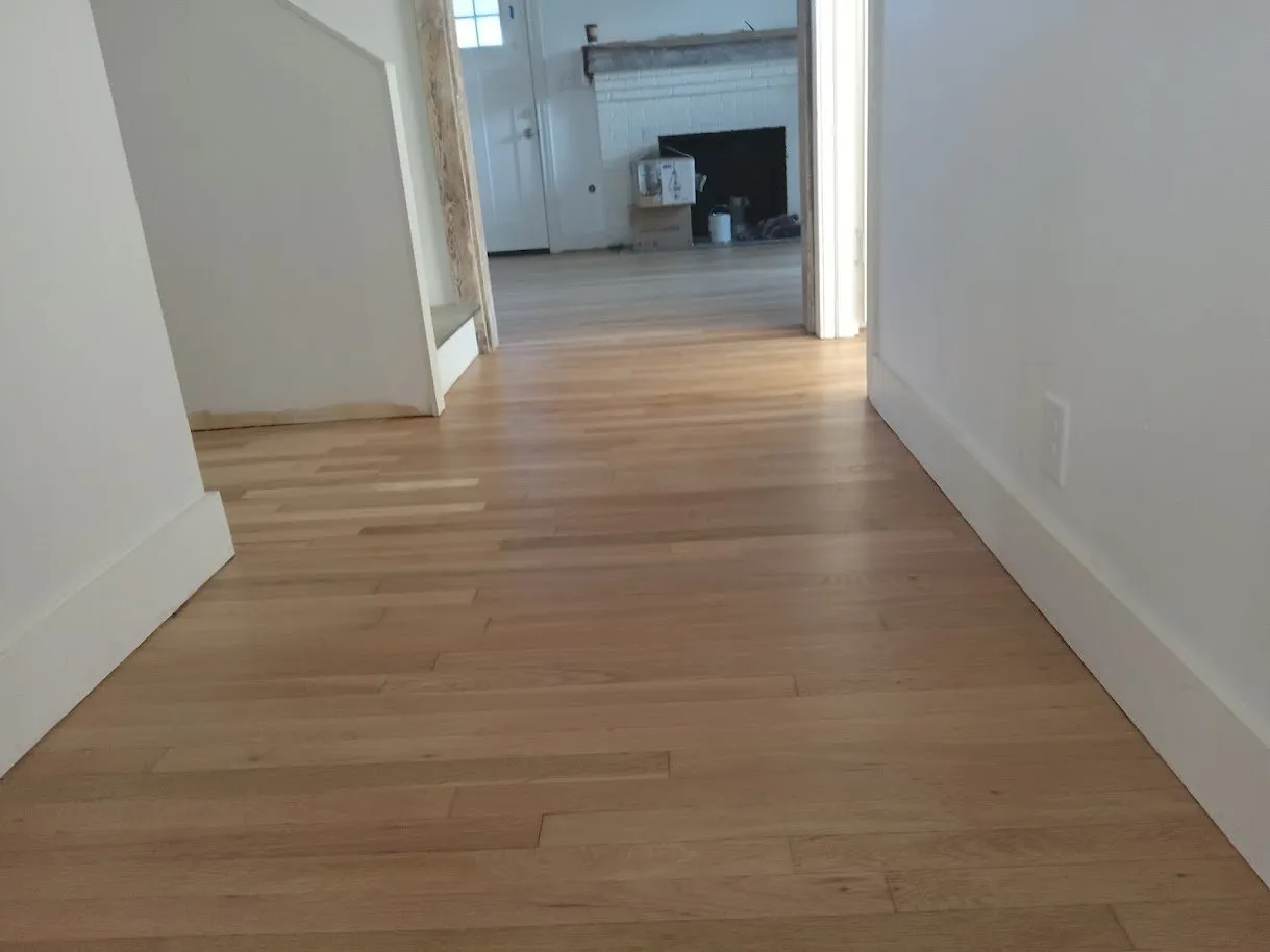 Natural white oak hallway after the cherry stain was sanded off